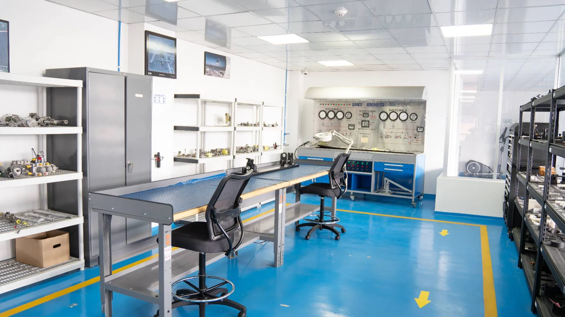 An interior room with a central table and multiple chairs arranged around it